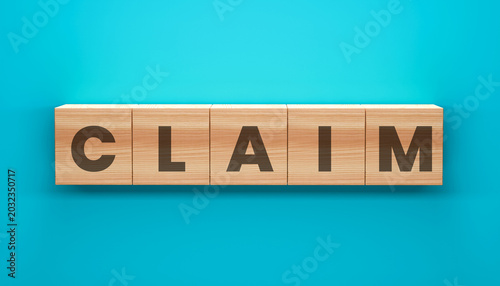 Photos The word CLAIM spelled out on wooden blocks against a vibrant blue background, representing the concept of making a claim or assertion