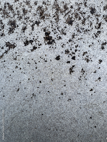 Canvas Print Gritty textural gradient featuring a dark particulate cascade on a pale, eroded