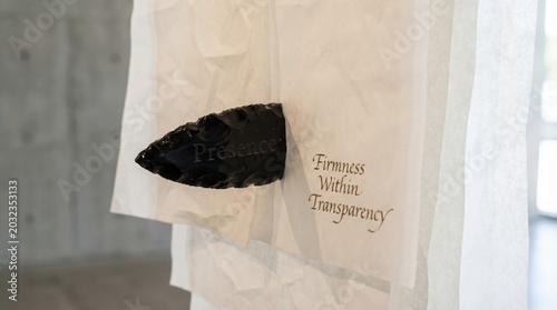 Stone Artifact Next to a Backdrop of Layered Transparency