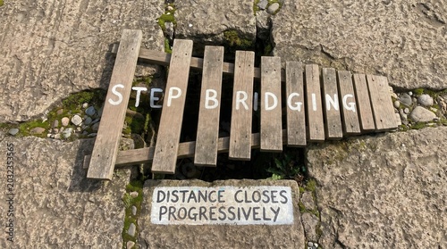 Wooden Step Bridging Over a Gap With Progressive Distance