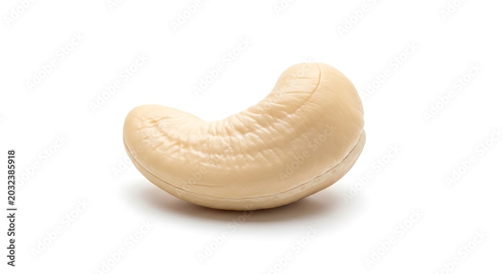 Fototapeta premium Close up of a single raw cashew nut isolated on white background