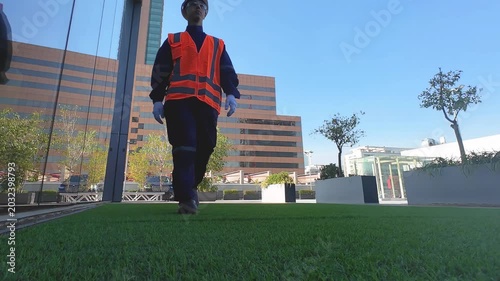 Industrial Professional Walking Through Modern Corporate Infrastructure Environment