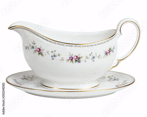 classic porcelain gravy boat on a matching saucer