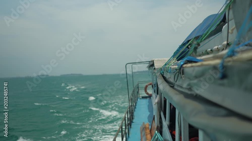 Cruising on a boat across choppy waters on a cloudy day