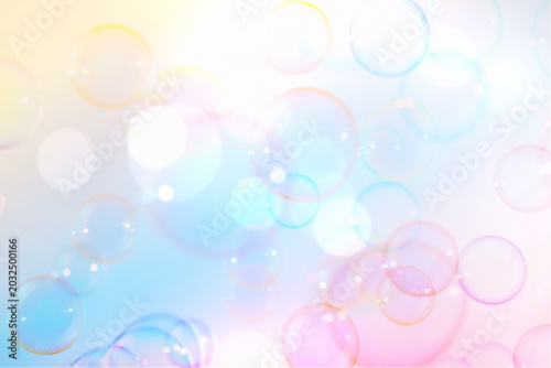 Beautiful Clear Colorful Soap Bubbles Fantasy. Celebration Festive Backdrop. Freshness Soap Suds Bubbles Water. Blue, Pink and White Gradient Textured. Colors Fantasy Blurred Background.