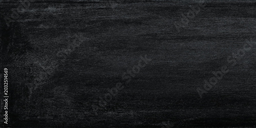 Photos Dark textured wall background with subtle gray undertones and rough canvas-like
