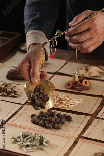 Konstfotografi Chinese Medicine Practitioner Weighing Herbs on Traditional Brass Scale for Heal