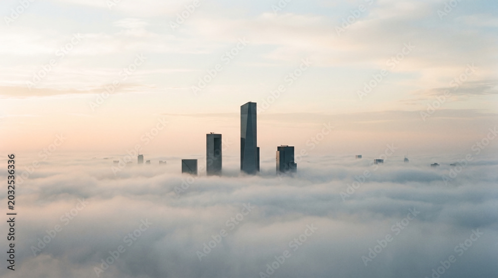 Fototapeta premium Serene minimalist view of architectural concrete forms emerging from dense morning urban industrial smog atmosphere