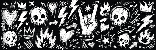 Foto Set of handdrawn rock and roll doodle elements, skulls, hearts, lightning bolts,