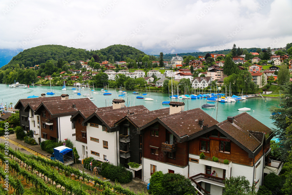 Fototapeta premium Bern Switzerland Lakeside Village with Sailboats and Alpine Mountains