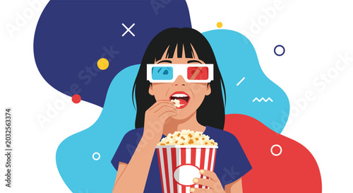 Excited young girl wearing red and blue 3d glasses eats popcorn from a striped bucket while watching a movie at the cinema.