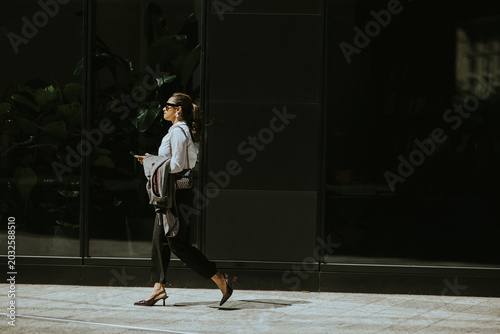 Woman walking on urban side...