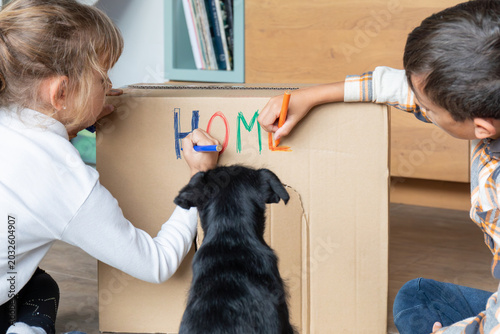 Canvastavla Children creating cardboard dog house for rescued puppy