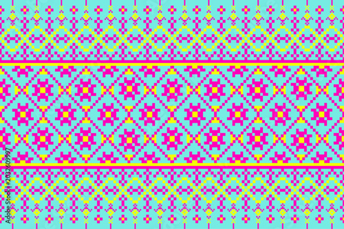 seamless geometric pattern
Cultural patterns use geometric shapes arranged into flowers in pink, with yellow zigzag lines. These patterns are used in fashion, with a blue background, 

