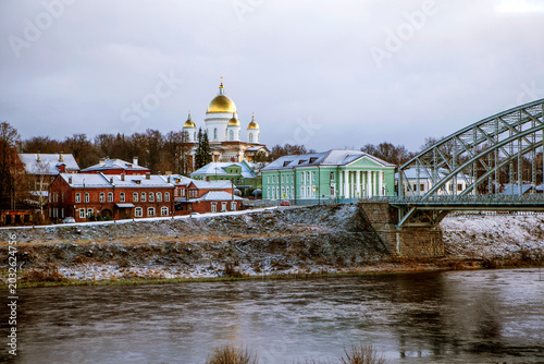 The city's main attractions include the Belelyubsky Arch Bridge, the Cathedral of the Holy Life-Giving Trinity (Trinity Cathedral), the Msta River, and the historic buildings on the October Revolution