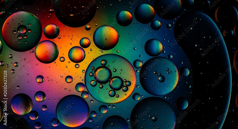 Fototapeta premium Vibrant colorful oil bubbles, rainbow macro, abstract background, shiny spheres