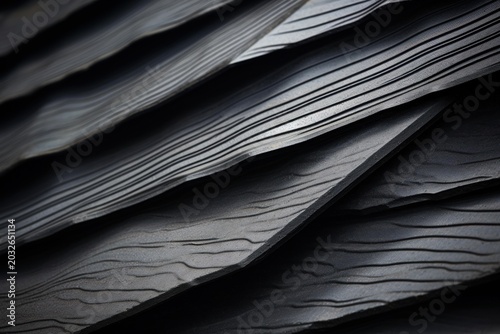 Close up of overlapping rubber sheets, showcasing textured surface and industrial aesthetic