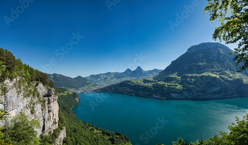 Large panorama of the cradle of Switzerland in summer with blue sky, including Lake Waldstäter and Rütli Meadow.