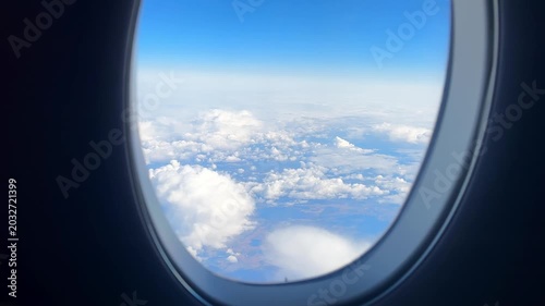 View From Airplane Window Above Clouds, Soft Porthole Frame, Deep Blue Sky And Fluffy Cumulus Layers, Tranquil Mood For Solo Traveler Daydreaming And Relaxation, Perfect For Travel And Meditation