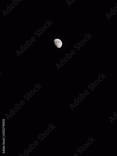 Фотография moon in the night sky, waxing gibbous