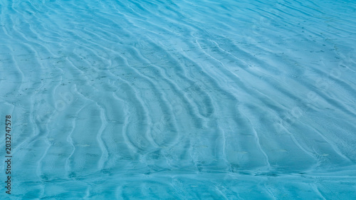 Foto Summer background lagoon Ripples in the sand at low tide on a beach with sandbar