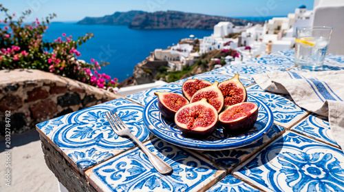 Fresh figs on blue Mediterranean ceramic table by the sea
