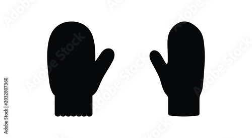 Bild auf Leinwand Pair of winter mittens depicted as a flat black silhouette against a white backg