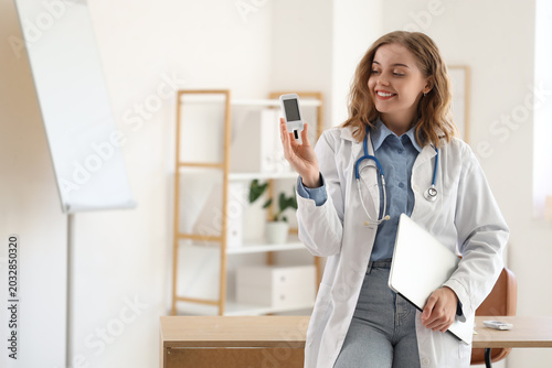 Female doctor with laptop a...