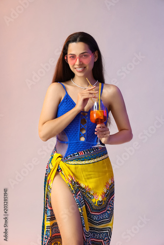 Young woman in swimsuit wit...
