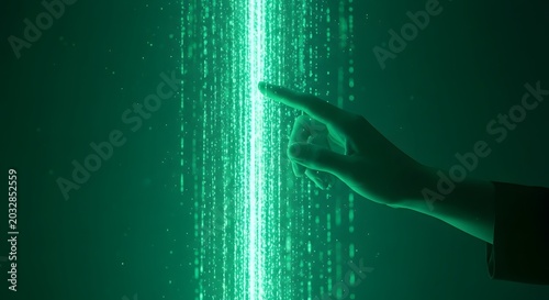 Touching the future a hand connects with an illuminated stream of digital information