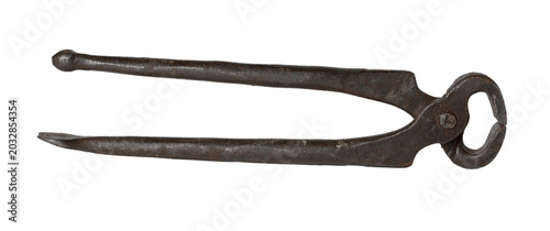 Vintage metal tongs with riveted joint, isolated on white background, close-up.