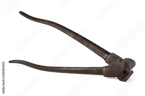 Worn wrought iron pliers, close-up shot, isolated composition