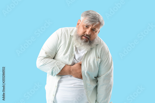 Senior man having heart att...