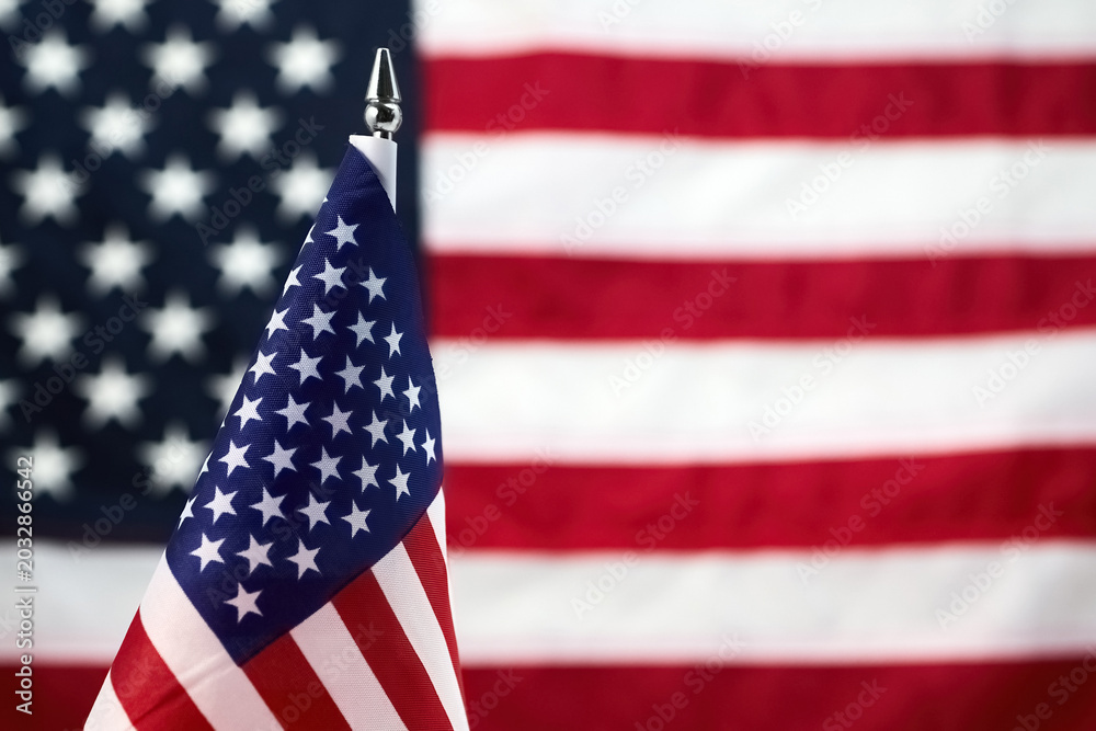 Fototapeta premium American flag desktop miniature with blurred background symbol usa