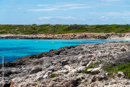 Canvastavla Pristine turquoise sea bay and wild rocky beach on Menorca island, Balearic Islands