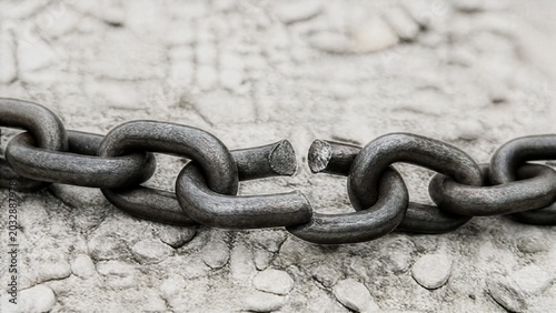 restraint. Broken heavy chain lying on pale gravel in soft natural light. gardening catalogs, home-decor guides, designed for gardening and botanical catalogs, celebrates nature.