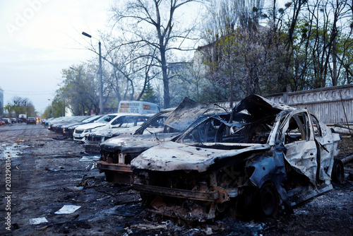 Принти на полотні Destroyed and burned out vehicles lie scattered at the site of a devastating Rus