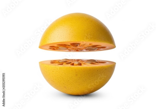 Fresh bael fruit cut in half isolated on white background
