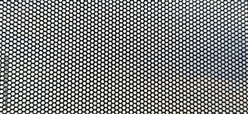 Εκτύπωση καμβά An enlarged image of a see-through sticker, which has small perforations throughout the sheet