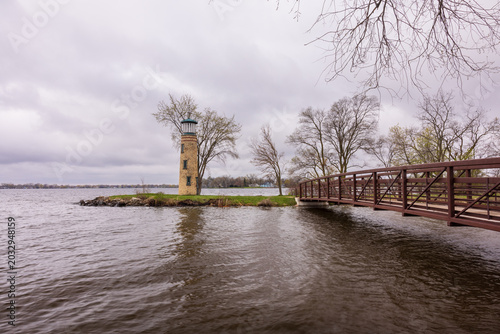 A Lighthouse On A Small Island On A Lake