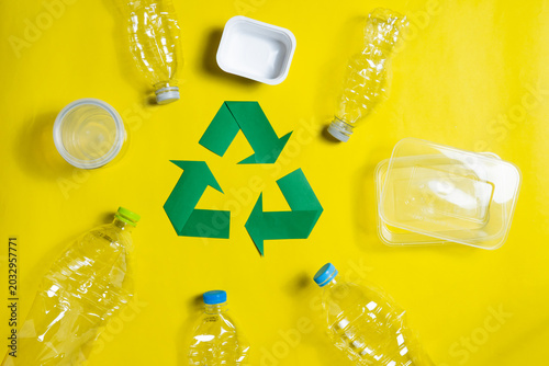 Plastic Recycling and Sustainability Concept on Bright Yellow Background
