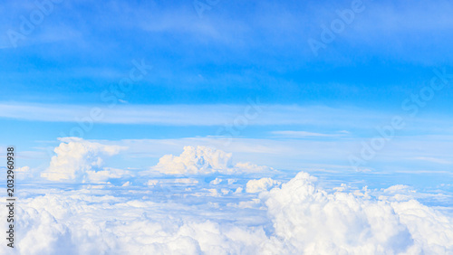 Photography Clouds and blue sky seen from above during a flight over a clear landscape in da