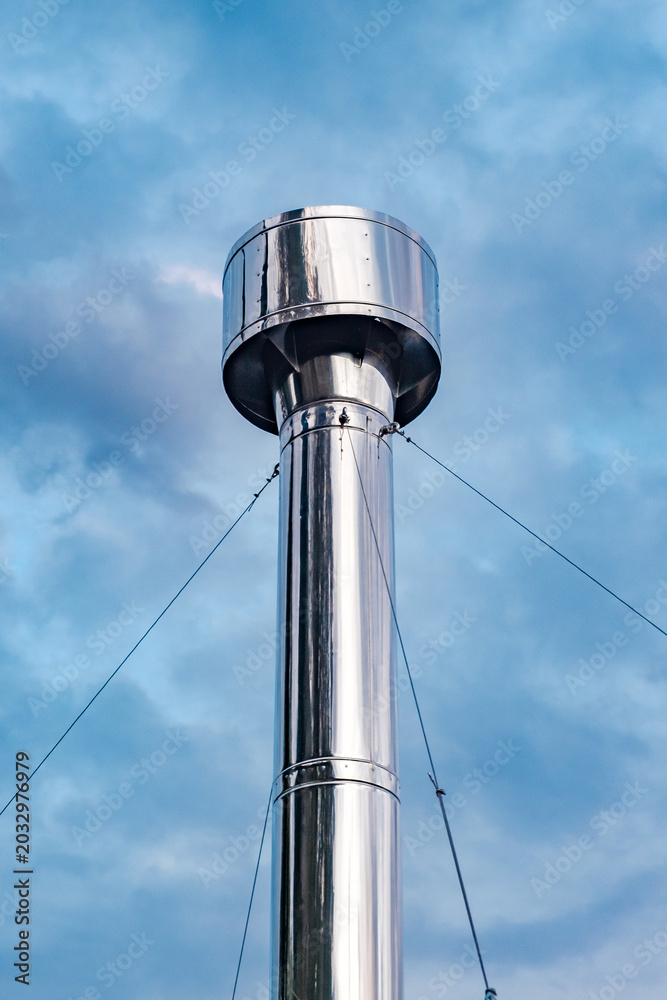 Fototapeta premium metal round chimney at sky background