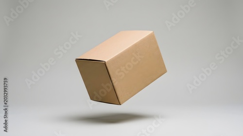 Cardboard Box Floating in Mid-Air - Isolated on a Clean Gray Background.