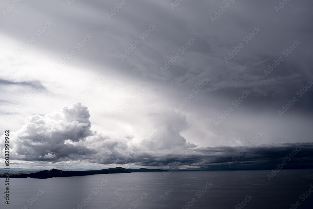 Fototapeta premium View of Lake Titicaca from Amantani Island under stormy clouds