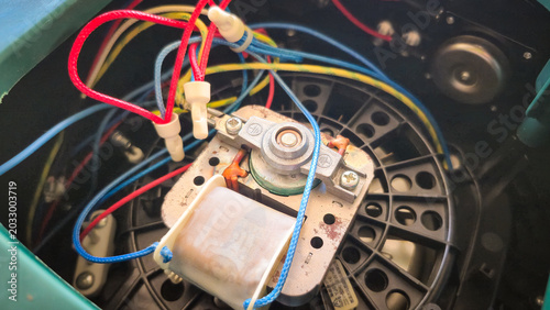 Bild auf Leinwand Close‑Up of Electromechanical Component with Wires and Coil