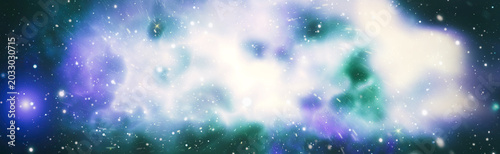 Panoramic abstract space background. Colorful glowing nebula, stardust and shining stars in deep universe.
