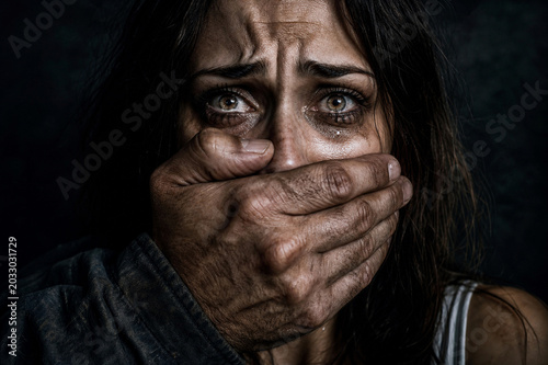 Woman with Hand Over Her Mouth Crying Domestic Violence Awareness