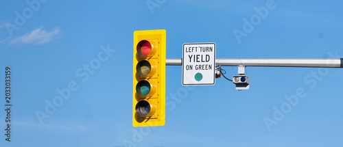 Close-up of a traffic signal and regulatory sign under blue sky, copy space