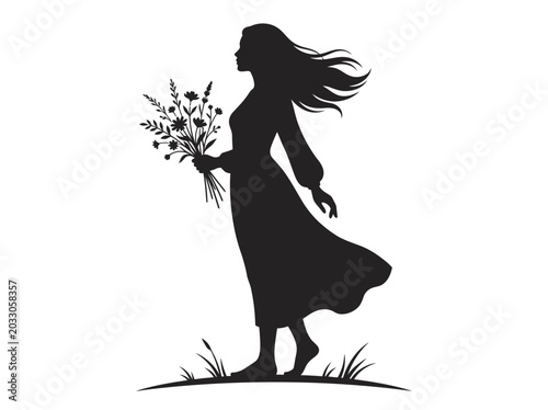 Silhouette of a woman walking with a bouquet of wildflowers.